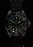 MWC 24 Jewel 1982 Pattern 300m Automatic Military Divers Watch in Black PVD with a Sapphire Crystal on a NATO Webbing Strap (Non Date Version)